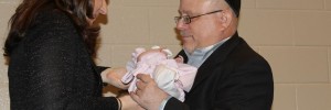 Jewish rabbi blessing a baby
